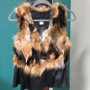Jocelyn red fox fur vest with leather ruffle.